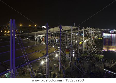 MILAN, ITALY - OCTOBER 12 2015: View from the top of Expo 2015 area at night with its pavilion and main promenade. Expo was held in Milan from May to October 2015