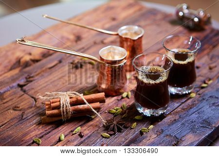 Traditional Arabic coffee. Traditional Arabic coffee. Two copper pots and two glass cups