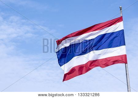 the national flag of Thailand blow at the flag pole.Thailand national flag with the blue sky.The national flag of Thailand with the sky.The Thailand flag waving with the sky.Beautiful Thailand flag.