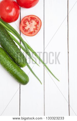 Set Fresh Vegetables  On White Wooden Table. Omato, Cucumber And Green Onion