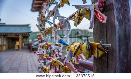 Japanese omikuji, or fortune slip, found at shrines or temples in Japan. These contain small slips of paper with prayers and wishes.