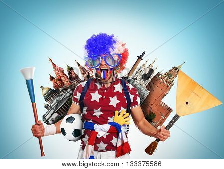 Russia football fan in a red wig and horns
