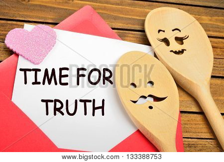 The words Time for truth on white paper