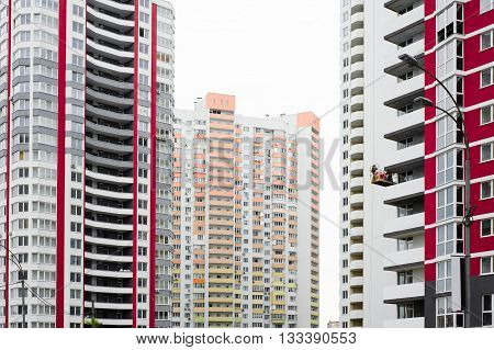 Construction site with new unfinished panel buildings isolated on white background
