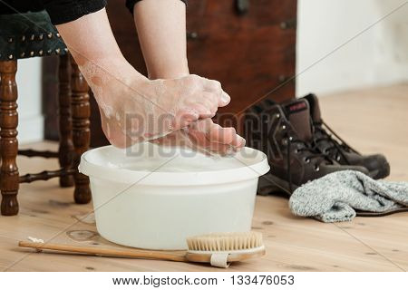 Curled Up Toes Over Cold Soapy Water And Brush