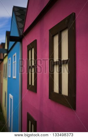 Wood window on the facade with bright house.