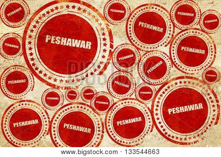peshawar, red stamp on a grunge paper texture