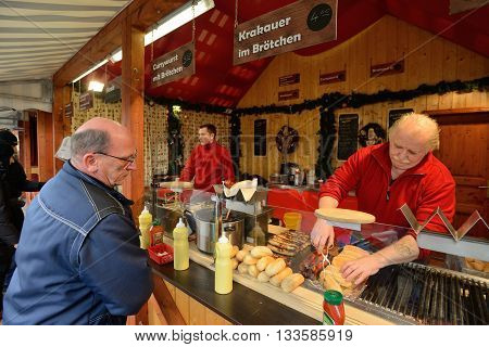 BERLIN - DECEMBER 26: Unidentified people trades food in annual traditional Christmas fair in Alexanderplatz on 26 December 2014 in Berlin Germany.
