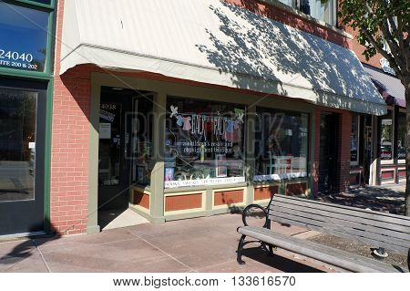 PLAINFIELD, ILLINOIS / UNITED STATES - SEPTEMBER 20, 2015: Back on the Rack offers used children's clothing and other items, including resale and consignment, in downtown Plainfield.
