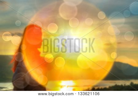 Abstract Blurred and soft photo of Women on hilltop with bokeh of sunrise on the natural background
