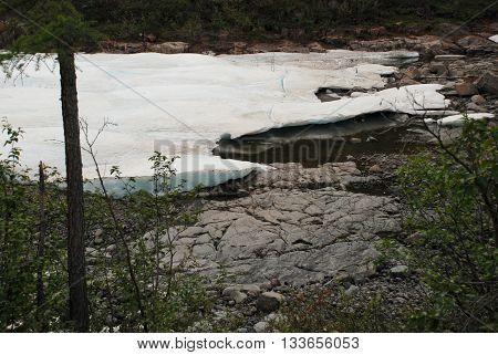The ice-field in the tideway of the mountain river. The Putorana plateau Taimyr Peninsula Russia.