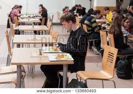 Young People Having Lunch In The Restaurant  At Animefest