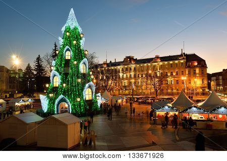 VILNIUS LITHUANIA - DECEMBER 16: night view of the christmas tree in Vilnius on December 16 2015 in Vilnius Lithuania. In 1994 the Vilnius Old Town was included in the UNESCO World Heritage List.
