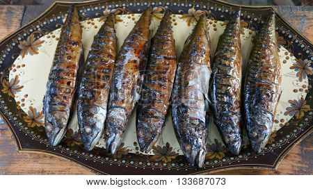 Marine fish baked on the grill is a tray