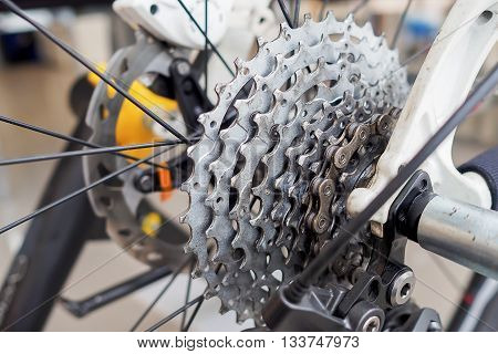 Closeup of a bicycle gears mechanism and chain on the rear wheel of mountain bike.