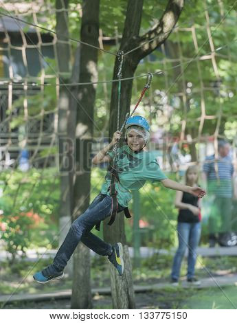 Rostov-on-Don Russia- May 29 2016: Boy trains in rope park 