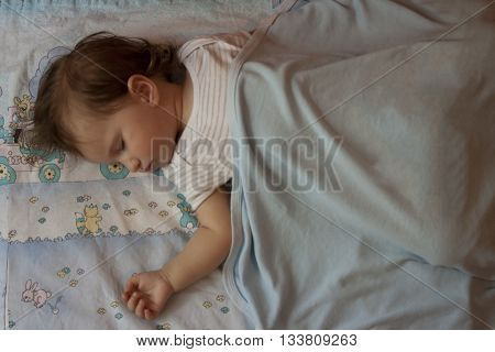 Baby being peaceful while sleeping the boredom away