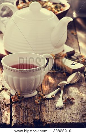 Dried medicinal herbs and helpful tea on a wooden table.( Carqueja and Genista Tridentata). Alternative treatment . Selective focus. Toned image