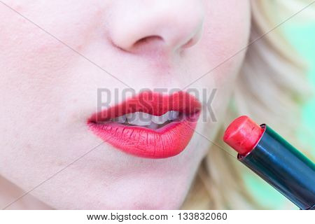 Lips with lipstick makeup for the face.