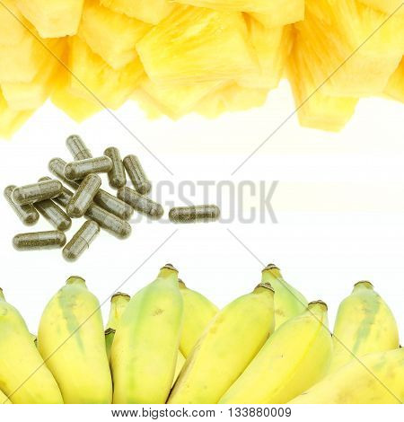 capsule pineapple and bananas isolated on the white background