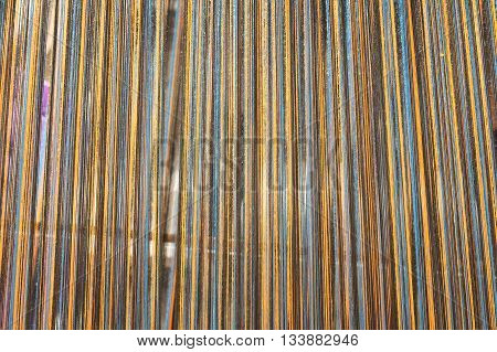 A kind of handloom use for northern style homemade silk or textile production in the scene appear the multicolor weave represent traditional northern Thailand garnet related concept idea.
