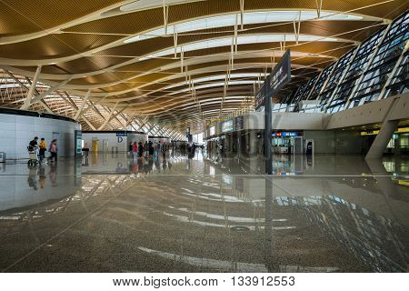 SHANGHAI, CHINA - MAY 27: Pudong Airport interior on June 7, 2016 in Shanghai, China. Pudong airport is the busiest international hub of mainland China, third busiest by cargo traffic in the world.