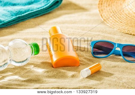 Various beach accessories in the sand on the beach