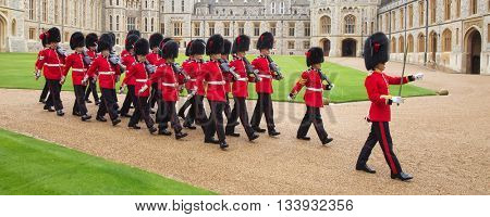 WINDSOR - APRIL 16: Unidentified men members of the royal guard during change ceremony on April 16, 2016 in Windsor, United Kingdom.