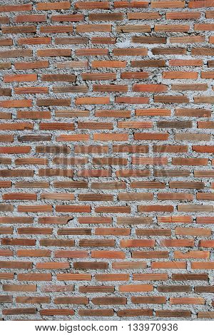 Texture of old weathered brick wall decayed and broken malfunctioning degraded for design background.