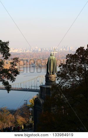 Autumn views of the Dnieper River the Pedestrian Bridge and statue of Volodymyr the Great in Kiev Ukraine Europe