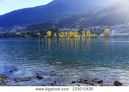 Beautiful Cityscape And Lake Wakatipu In Queenstown In Autumn , South Island Of New Zealand
