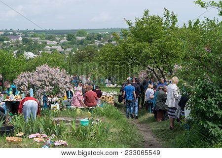 Tocuz, Moldova- 9 May, 2016: People In The Cemetery Celebrating The Dead During Memorial Easter.