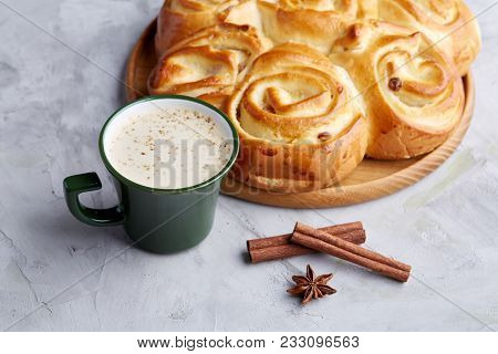 Festive Still Life With Homemade Rose Bread With Raisins, Cup Of Coffee, Anise And Cinnamon Over Whi