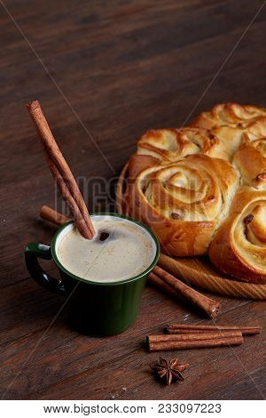 Homemade Rose Bread With Raisins On Wooden Tray, Cup Of Creamy Coffee, Anise And Cinnamon Over Vinta