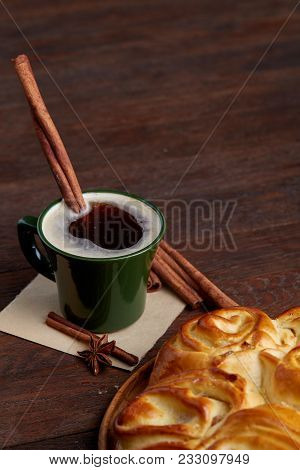 Homemade Rose Bread With Raisins On Wooden Tray, Cup Of Creamy Coffee, Anise And Cinnamon Over Vinta