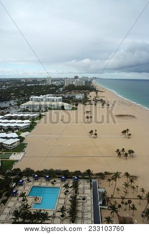 Sealine And Sand Beach With Pool On Cloudy Sky Background In Fort Lauderdale, Usa. Summer Vacation A
