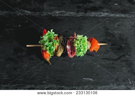 Spanish Snack, Banderillas On Skewers With Salami, Pickling Olives, Pickles, Green And Red Pepper.