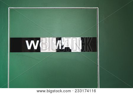 Green Door To The Toilet With An Inscription Woman. Aluminum Door Construction Without Clypeus.