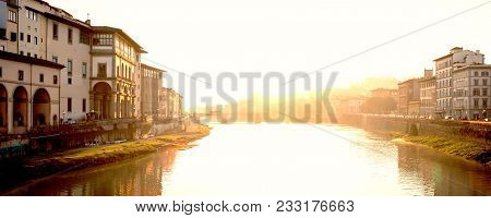 View Of Medieval Stone Bridge Ponte Santa Trinita  And Arno River From Ponte Vecchio Bridge  In Flor