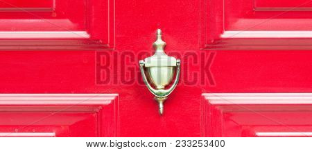 Old Antique Golden Brass Knocker On The Abstract Red Wooden Doors For Knocking Close Up
