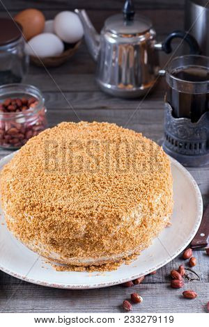 Homemade Biscuit Cake With Sour Cream On A Wooden Table