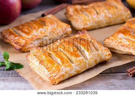 Puff Pastry Filled With Apples On A Wooden Table