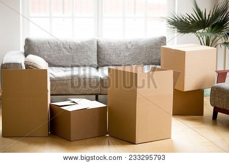 Cardboard Carton Boxes With Personal Belongings Household Stuff In Modern Living Room, Many Packed C