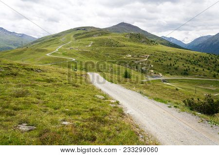 Bikepark Mottolino With Mountain Monte Della Neve Background, Livigno, Italy