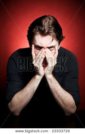 Portret of young sad man