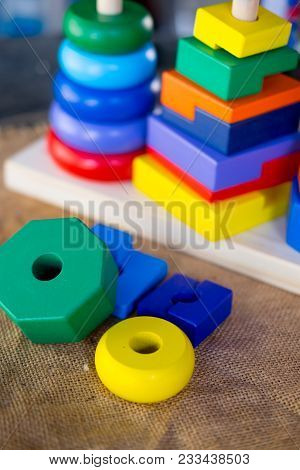 Pyramid Toy Composed Of Colorful Wooden Rings (close Up)