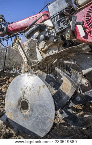 Detail Walking Tractor Equiped With Plow At Urban Park Ready To Work