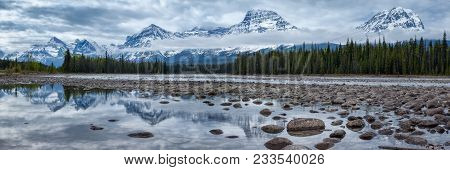 Mountains In Jasper National Park Along The Athabasca River, Alberta, Canada