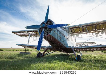 Abandoned Old Airplane On The Field. Single Engine Airplane