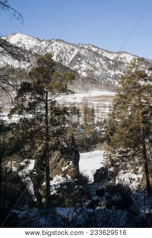 Frozen Mountain River Under Ice In Winter